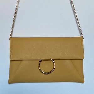 Yellow/mustard colored clutch with gold chain